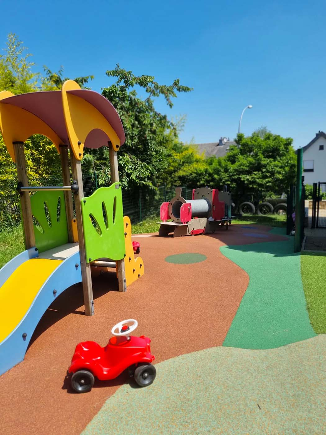 Outdoor playground at Le Pays Imaginaire nursery in Soleuvre